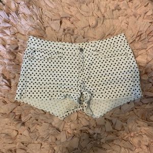 White and black polka dot shorts.